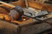 Pouring bronze into sand molds