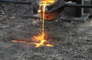 Pouring an Iron Cross in a mold carved in the ground.