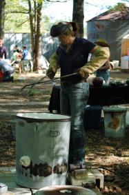 Kelly Landrum preparing her kiln for Raku