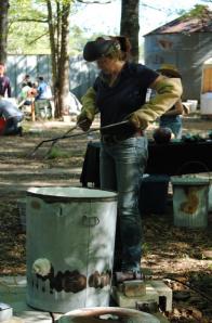 Kelly Landrum preparing her kiln for Raku