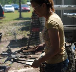 Deborah Davis forging a hummingbird