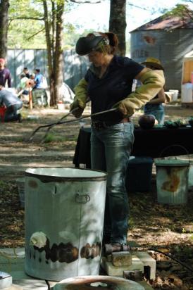 Kelly Landrum preparing her kiln for Raku
