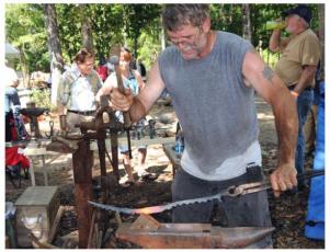 Working at the anvil during Fire in the Swamp 2009