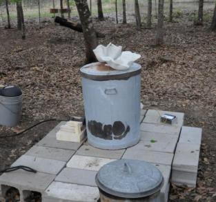 Raku kiln and pottery being pre-heated 