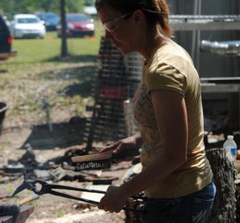 Deborah Davis forging a hummingbird