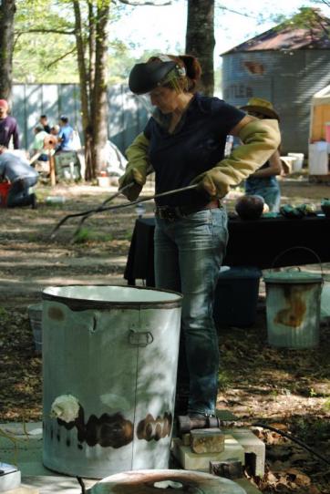 Kelly Landrum preparing her kiln for Raku