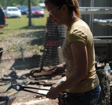 Deborah Davis forging a hummingbird