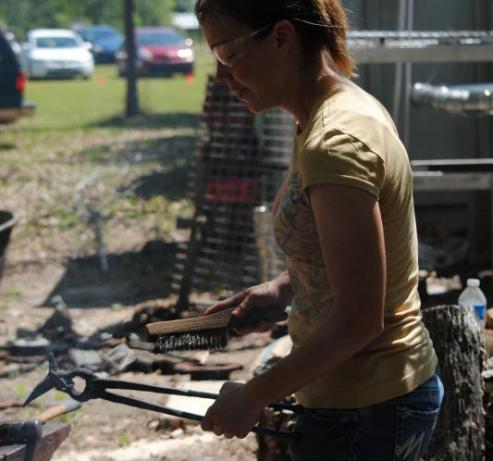 Deborah Davis forging a hummingbird